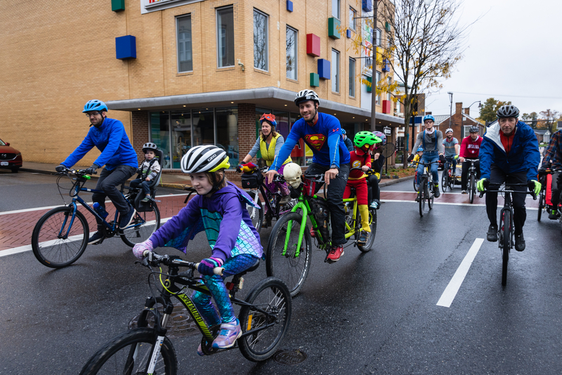 "Families on a bike ride in a Virginia neighborhood"
