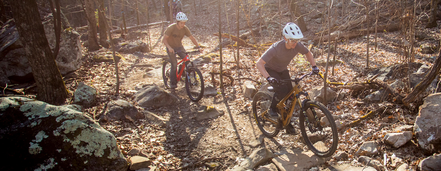 Two mountain bikers riding a rocky mountain bike trail in Waldens Ridge, a recipient of Trail Accelerator Grant