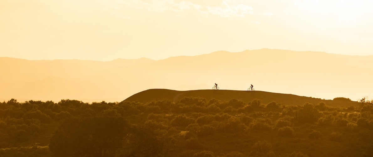 Two riders during golden hour in Colorado.