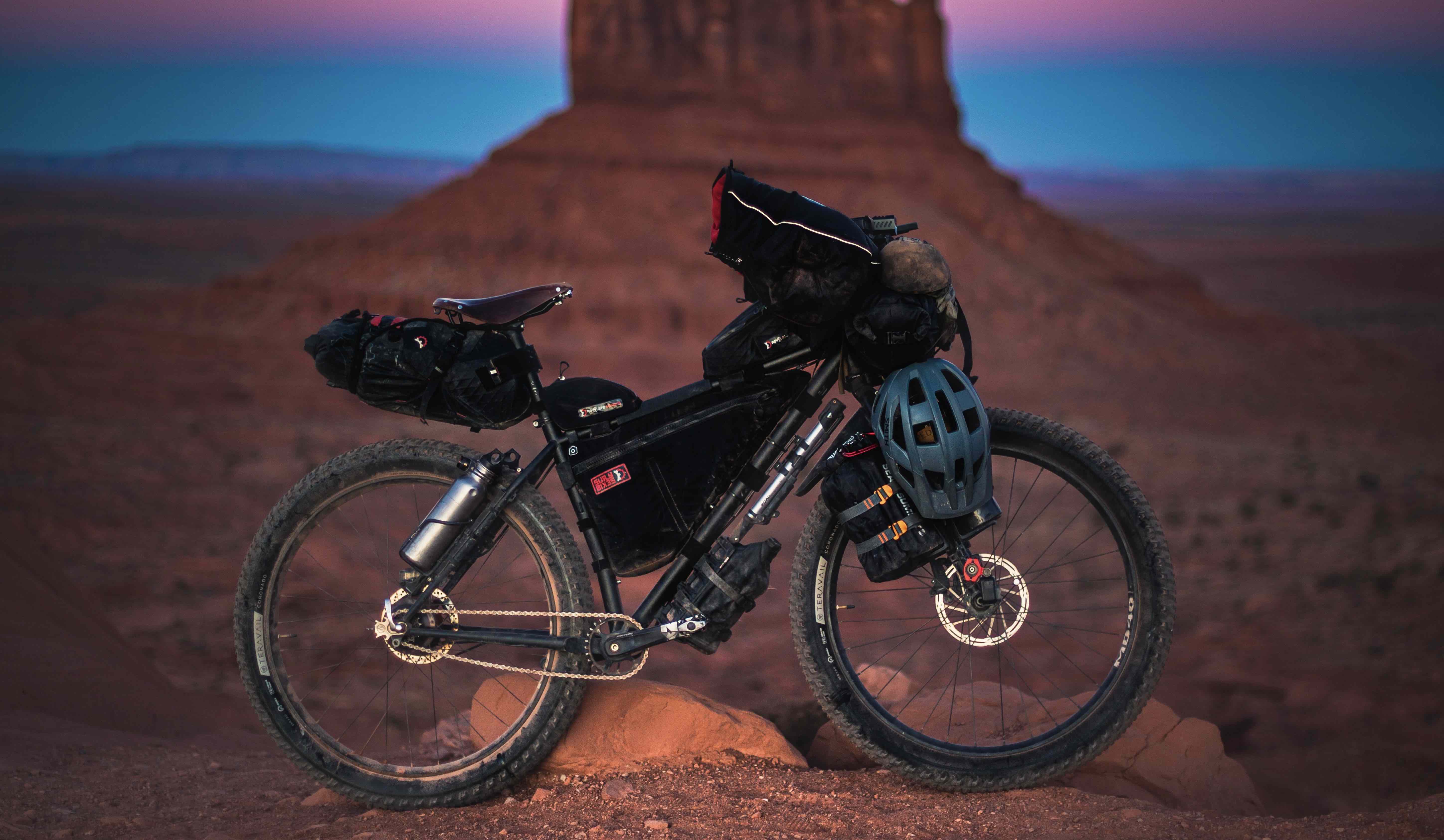 Bike loaded with packing gear, with desert background