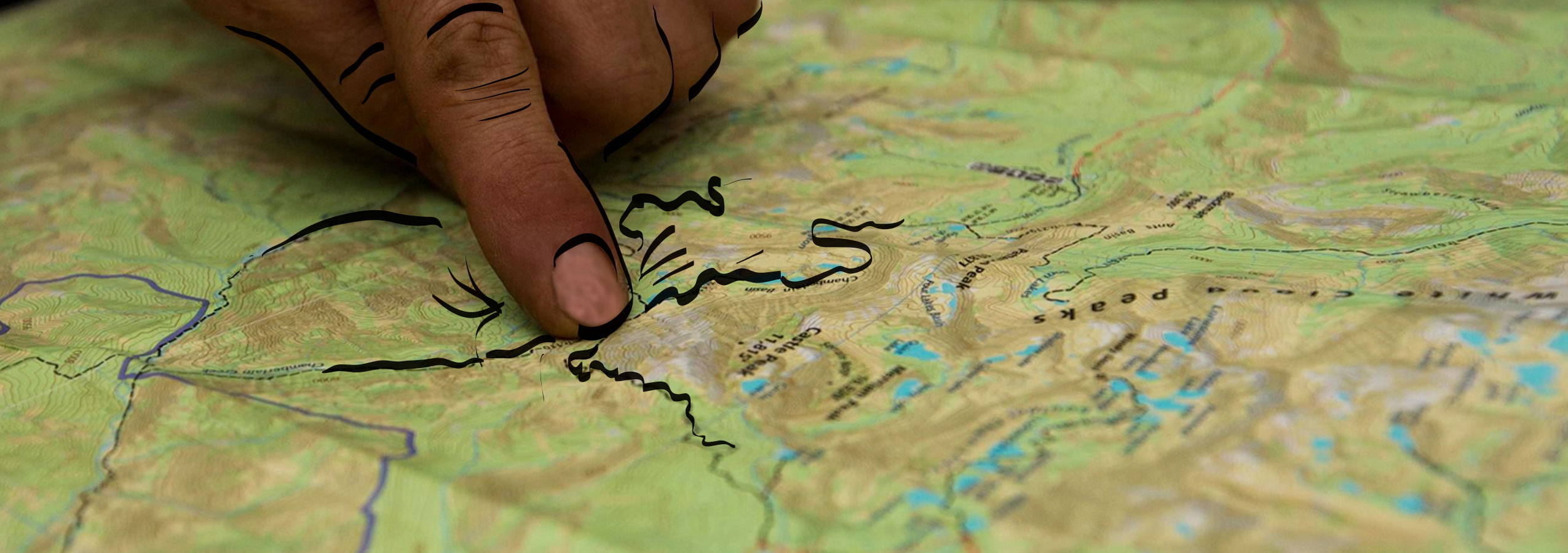 Person pointing on topo map