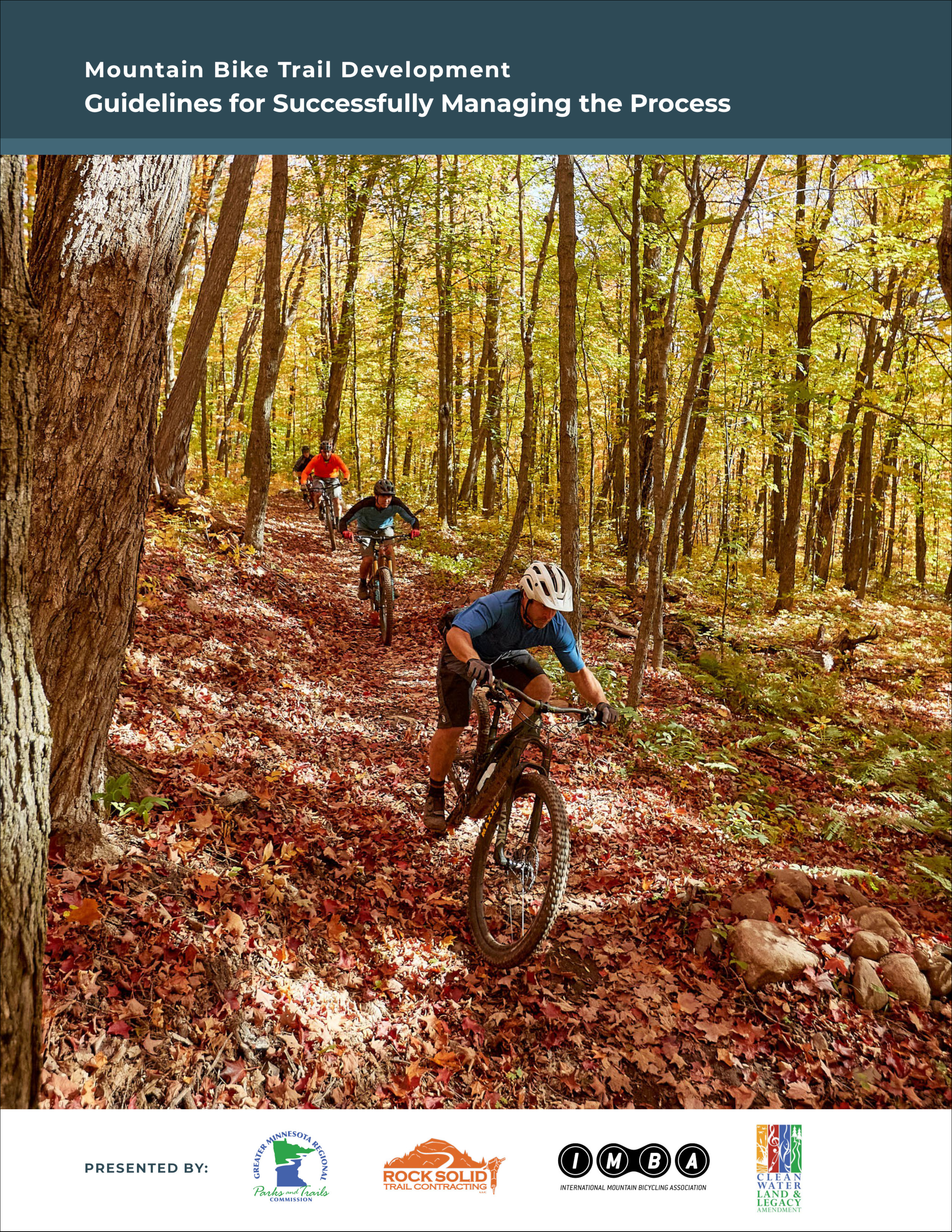 A book cover featuring a photo of mountain bikers riding downhill on a leaf covered trail among trees with green and yellow leaves