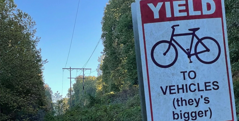Cyclists yield to vehicles (they's bigger)