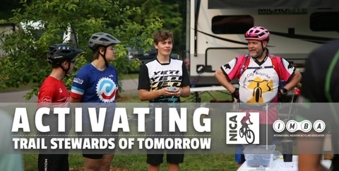 NICA riders talking shop with a coach at a RV at a race. 