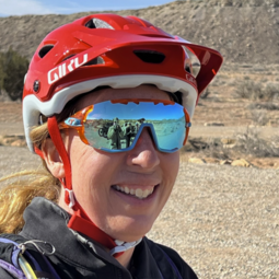 A closeup of of Dr. Jen with mountain biking helmet on. 